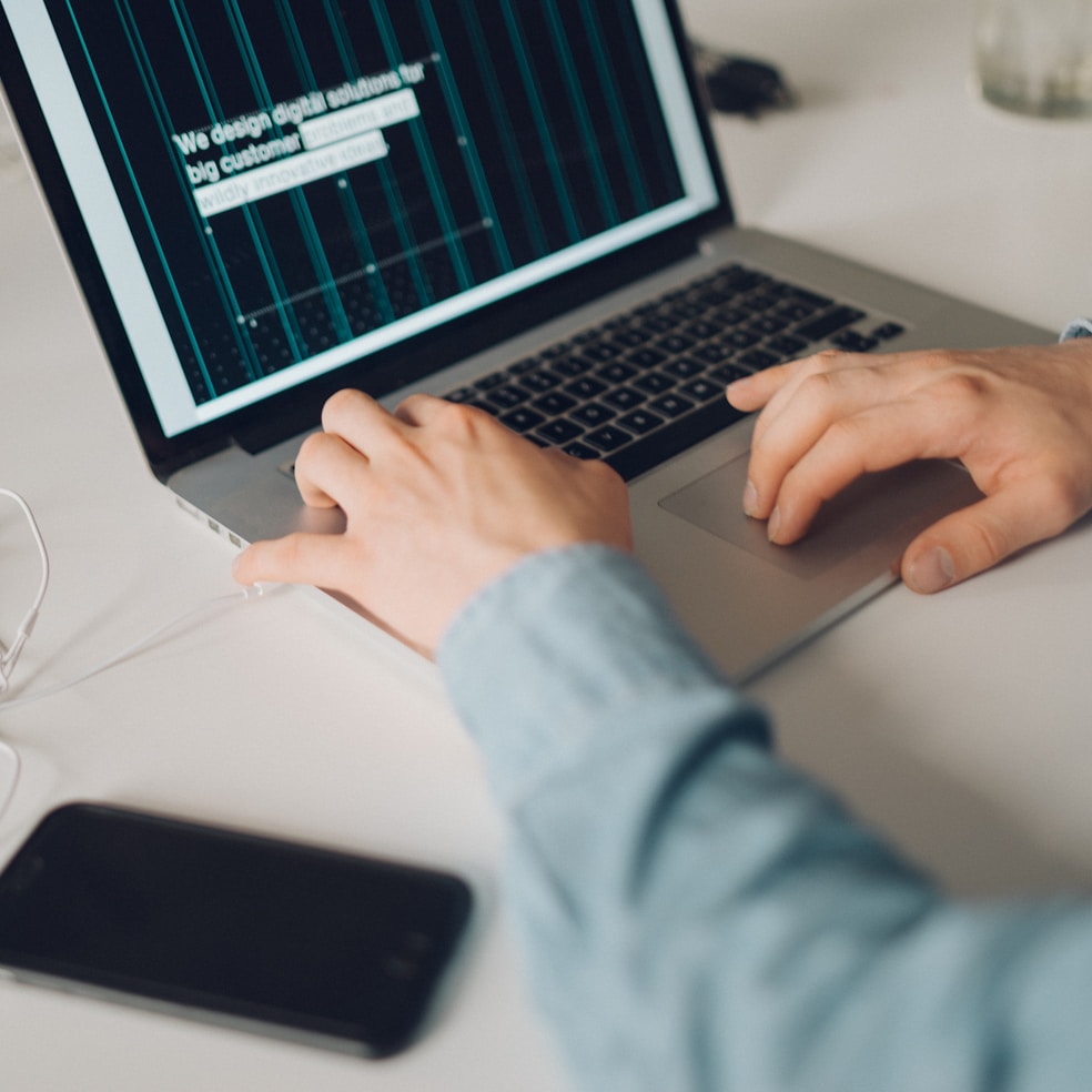 Hands on a laptop keyboard